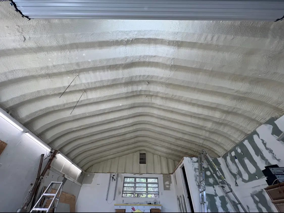 Spray polyurethane foam applied to the underside of a metal roof deck in Yukon